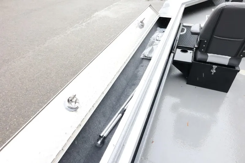 Slide: The Image of 2025 Thunder Jet 209 Rush OT boat interior with storage compartment and seating. - 19