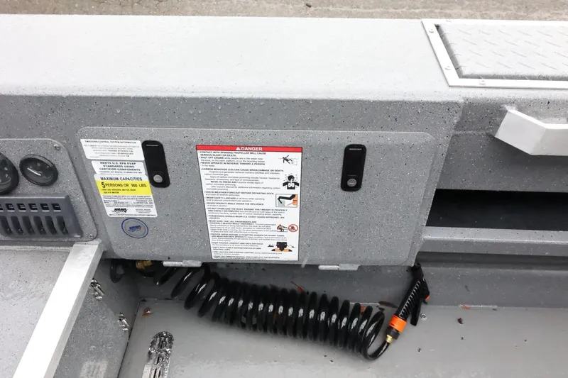 Slide: The Image of Control panel of 2025 Thunder Jet 209 Rush OT boat with safety warnings and gauges. - 22