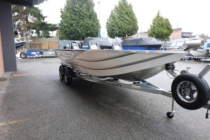 Slide: The Image of 2025 Thunder Jet 209 Rush OT boat on trailer in outdoor setting. - 4