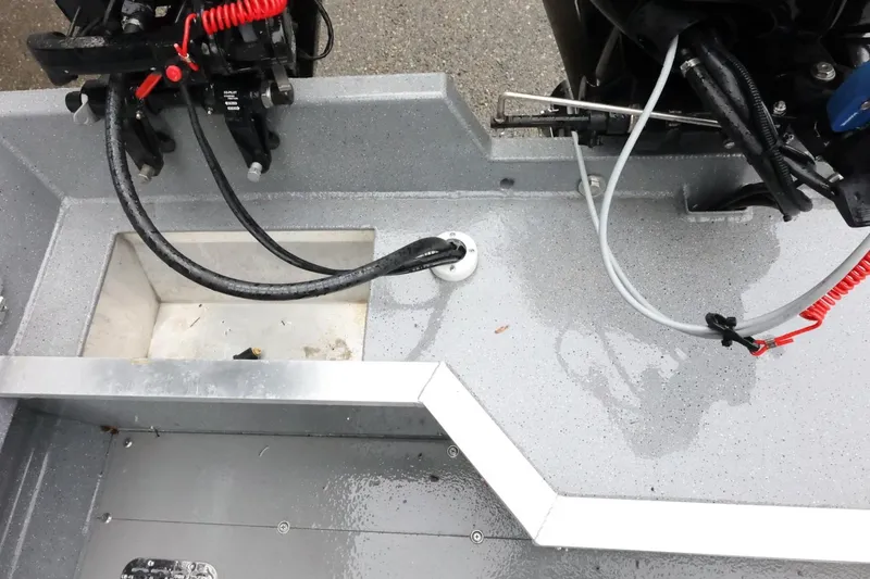 Slide: The Image of 2025 Thunder Jet 209 Rush OT boat interior with cables and controls. - 9