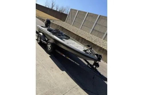 Slide: The Image of 1997 Ranger 461 VS Commanche boat on trailer, parked outdoors. - 5