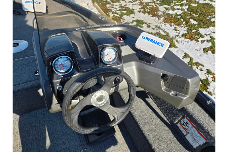 Slide: The Image of 2020 Tracker Pro Guide V-16 SC boat dashboard with Lowrance electronics and steering wheel. - 13