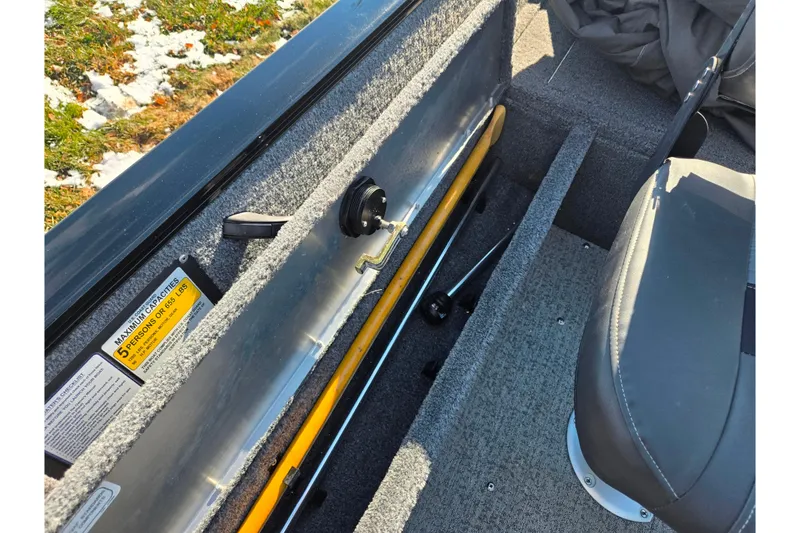 Slide: The Image of 2020 Tracker Pro Guide V-16 SC boat interior with storage compartment and seating. - 24