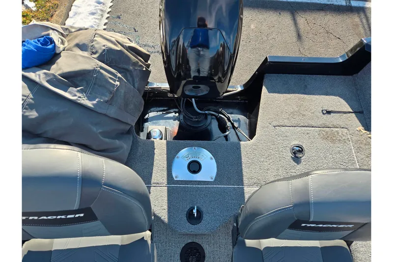 Slide: The Image of 2020 Tracker Pro Guide V-16 SC boat interior with seats and motor. - 25
