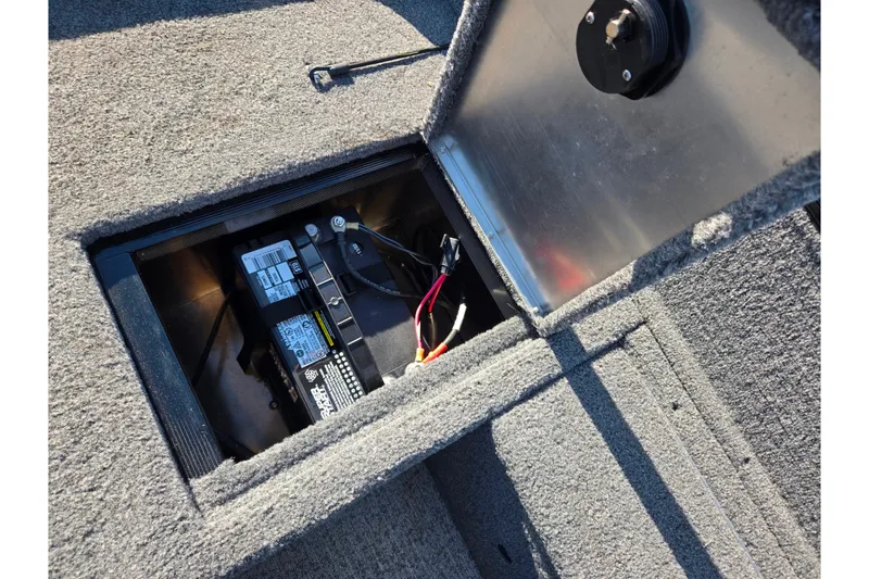 Slide: The Image of 2020 Tracker Pro Guide V-16 SC boat battery compartment with open hatch. - 26