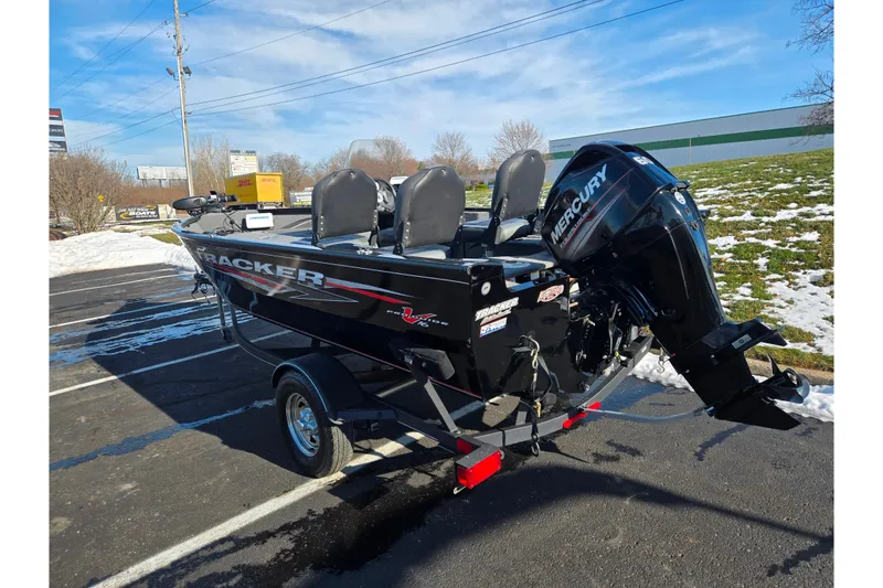 Slide: The Image of 2020 Tracker Pro Guide V-16 SC boat with Mercury engine on trailer in snowy parking lot. - 3