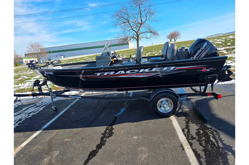 Slide: The Image of 2020 Tracker Pro Guide V-16 SC boat on trailer, parked outdoors. - 4