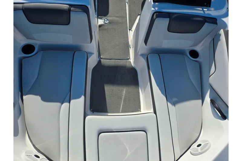 Slide: The Image of 2020 Yamaha Boats SX190 interior seating with gray upholstery and cup holders. - 18