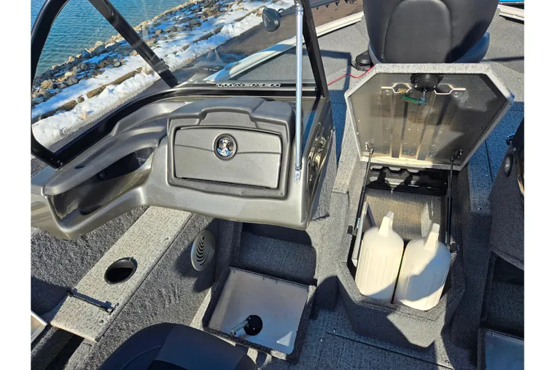 Slide: The Image of 2021 Tracker Pro Guide V-165 WT boat interior with storage compartments open. - 13