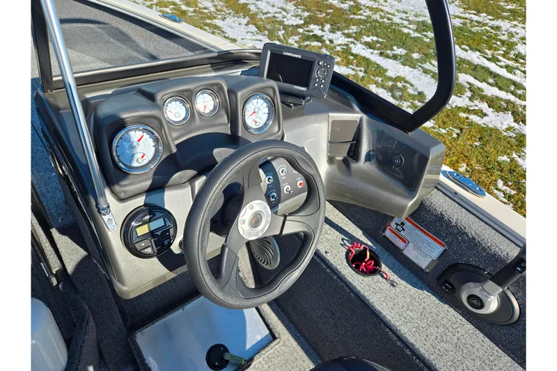 Slide: The Image of 2021 Tracker Pro Guide V-165 WT boat dashboard with steering wheel and gauges. - 15