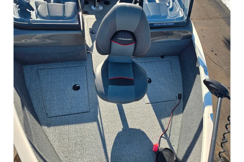 Slide: The Image of 2021 Tracker Pro Guide V-165 WT boat interior with seating and storage compartments. - 22