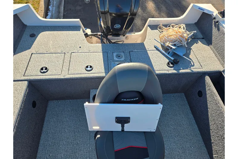 Slide: The Image of 2021 Tracker Pro Guide V-165 WT boat interior with seating and storage compartments. - 25