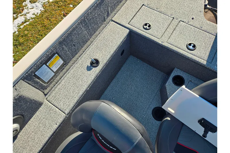 Slide: The Image of 2021 Tracker Pro Guide V-165 WT boat interior with gray carpet and seating. - 26