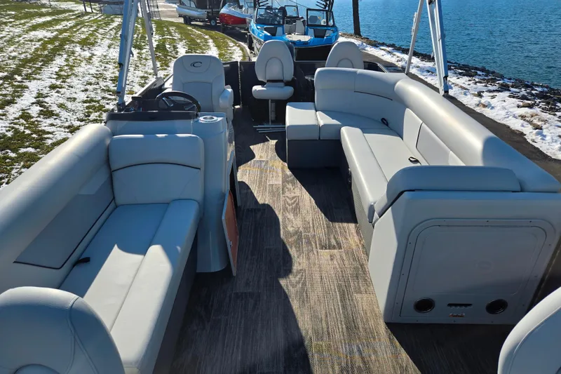 Slide: The Image of 2022 Crest Classic Fish 200 pontoon boat interior with plush seating and modern design. - 11