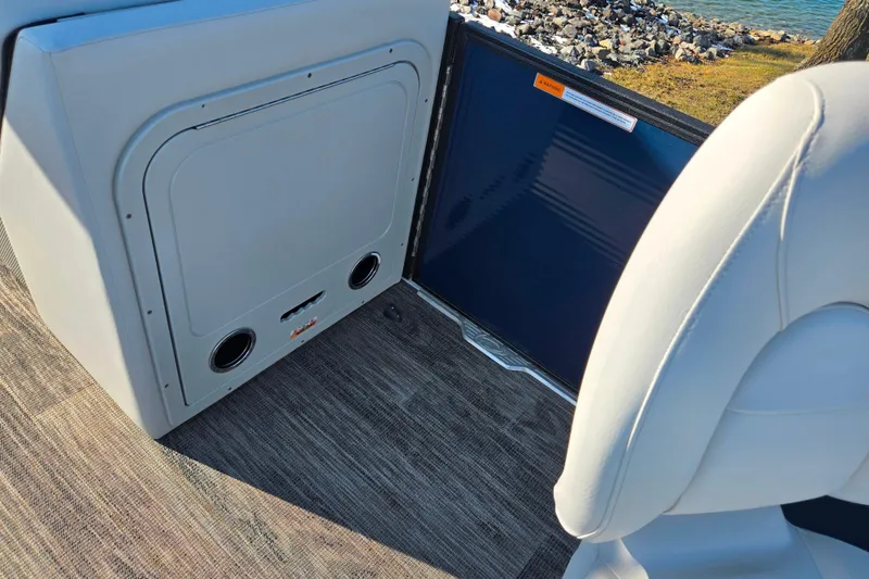 Slide: The Image of 2022 Crest Classic Fish 200 boat interior with seating and storage compartment. - 12