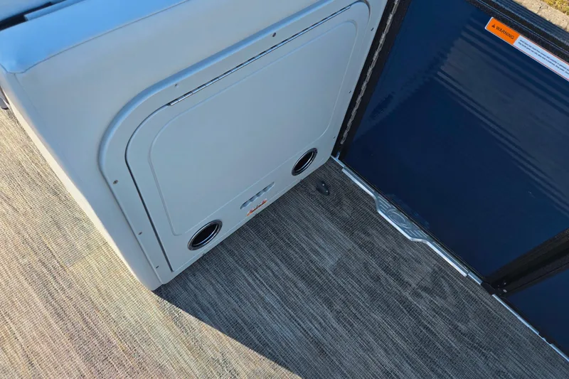 Slide: The Image of Interior view of 2022 Crest Classic Fish 200 boat, featuring storage compartment and flooring. - 13