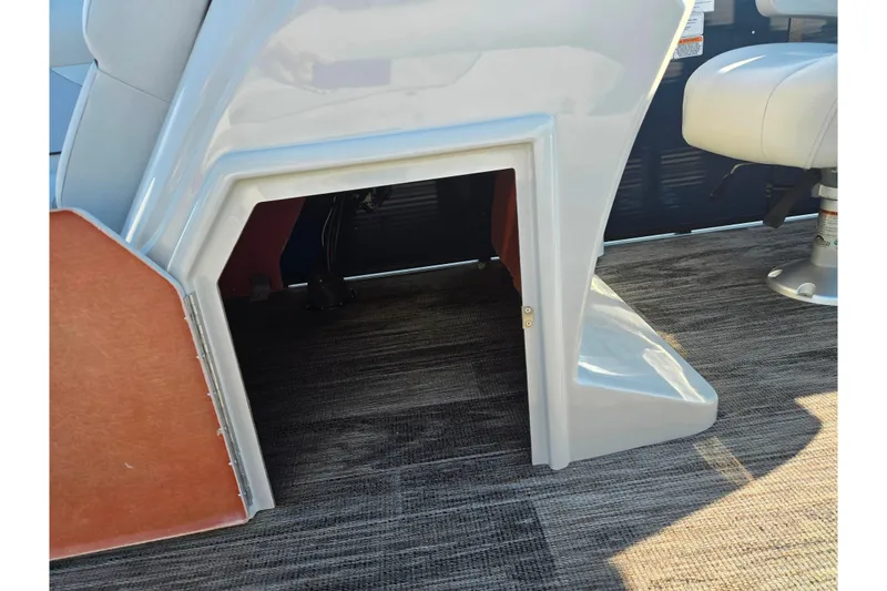 Slide: The Image of 2022 Crest Classic Fish 200 boat interior with seating and storage area. - 14