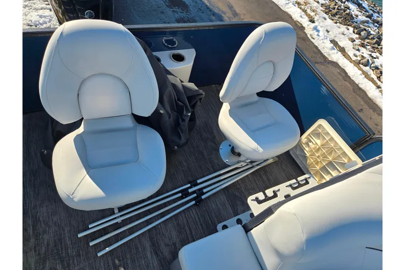 Slide: The Image of Interior of 2022 Crest Classic Fish 200 boat with white seats and accessories. - 20