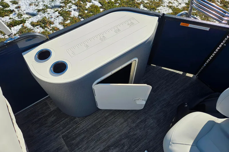 Slide: The Image of 2022 Crest Classic Fish 200 boat with storage compartment and cup holders. - 21