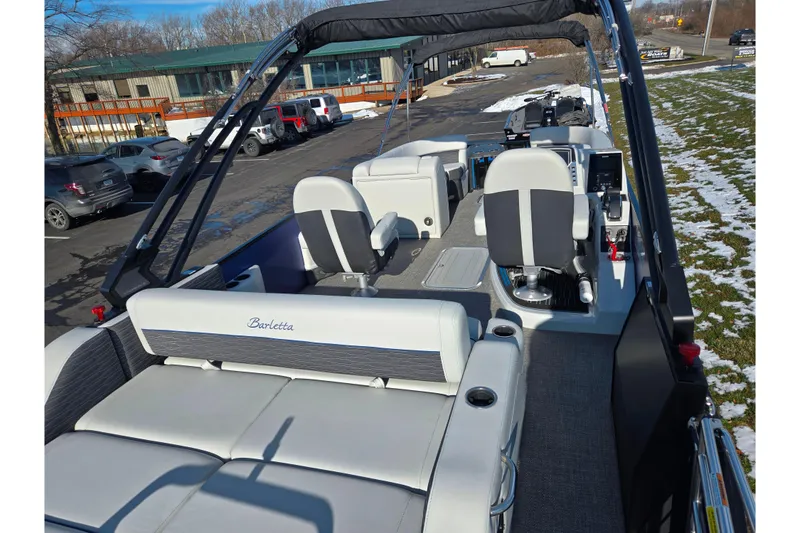 Slide: The Image of 2023 Barletta Corsa 23UC pontoon boat interior with seating and helm. - 12
