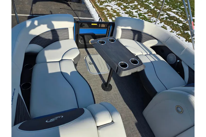 Slide: The Image of 2023 Barletta Corsa 23UC boat interior with plush seating and cupholders. - 20