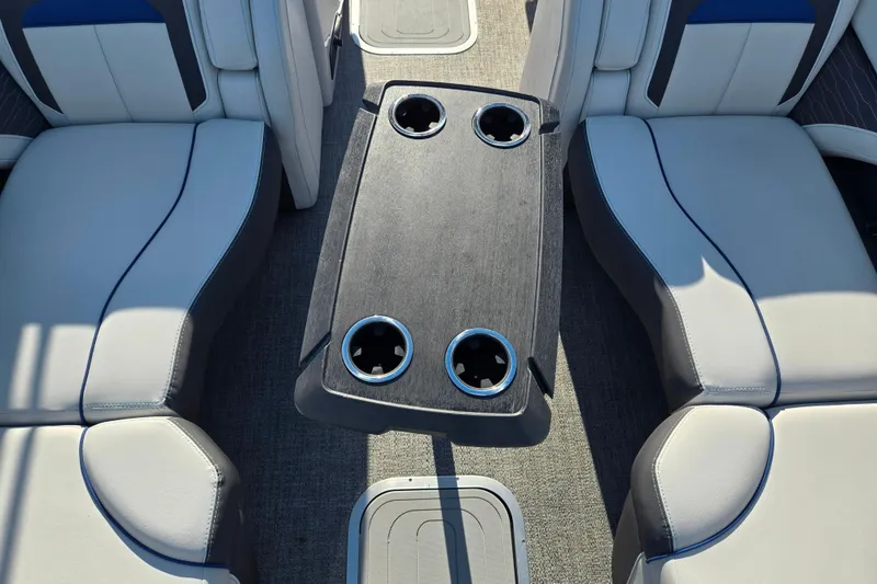 Slide: The Image of 2023 Barletta Corsa 23UC interior with seating and cup holders. - 23