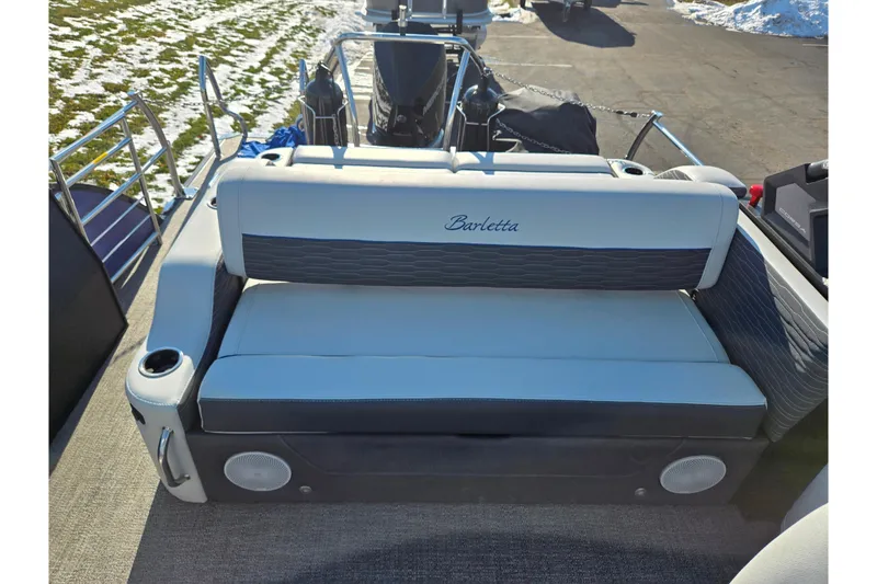 Slide: The Image of 2023 Barletta Corsa 23UC boat interior with cushioned seating and cup holders. - 26