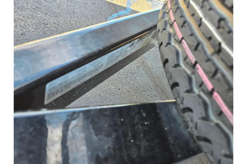 Slide: The Image of Close-up of a 2023 Barletta Corsa 23UC trailer tire and frame. - 8