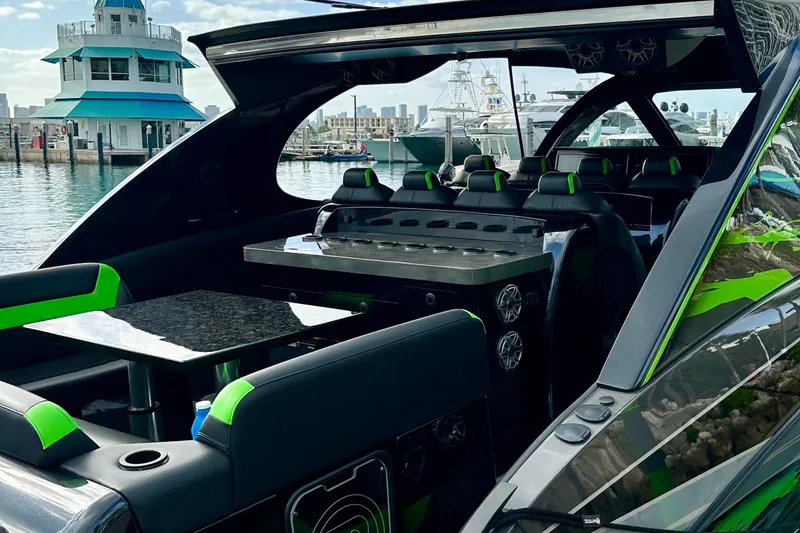 Slide: The Image of Luxurious 2026 Mystic Powerboats M5200 XL Cabin interior with sleek design and vibrant accents. - 13
