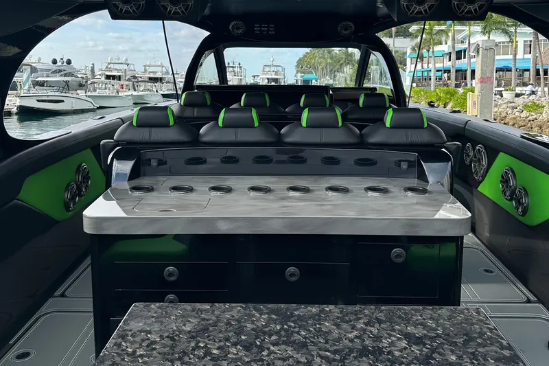 Slide: The Image of Luxurious interior of 2026 Mystic Powerboats M5200 XL Cabin with sleek seating and modern design. - 14