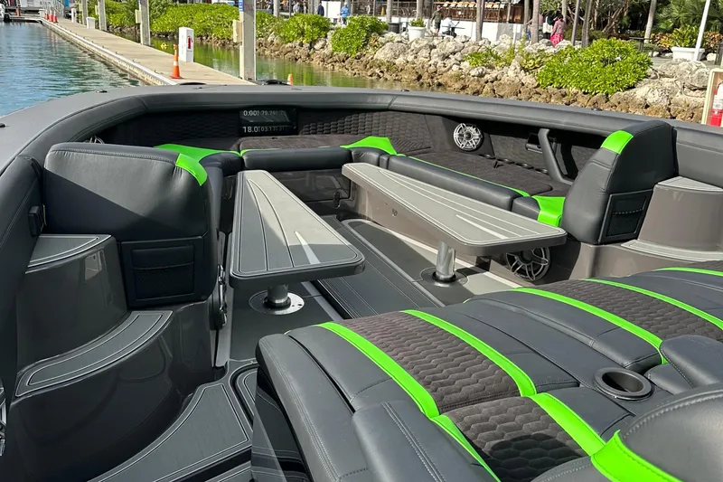 Slide: The Image of 2026 Mystic Powerboats M5200 XL Cabin interior with sleek seating and modern design. - 19