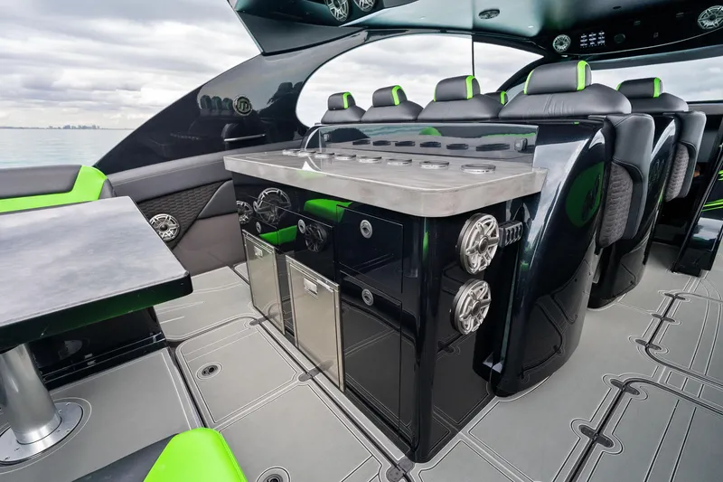 Slide: The Image of Luxurious interior of 2026 Mystic Powerboats M5200 XL Cabin with modern seating and sleek design. - 20