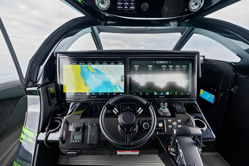 Slide: The Image of Cockpit of 2026 Mystic Powerboats M5200 XL Cabin with advanced navigation displays. - 23