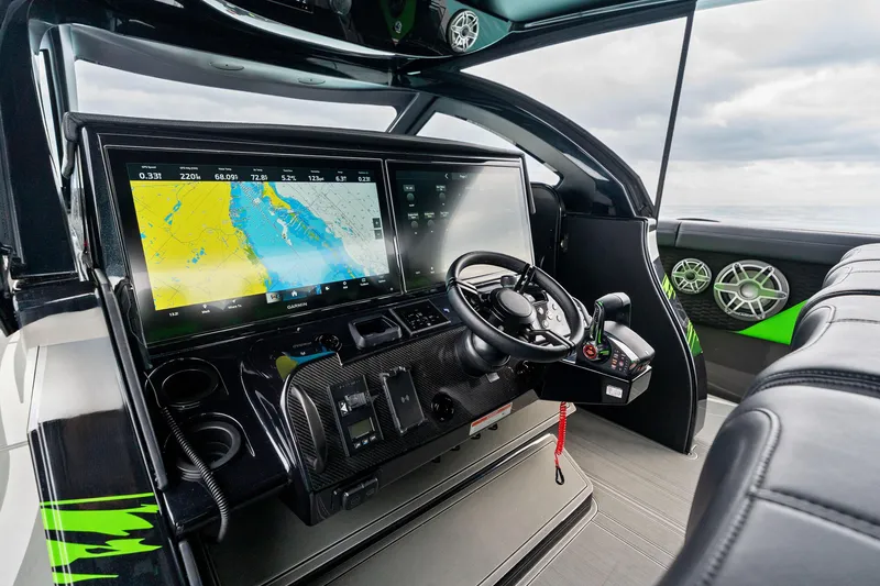 Slide: The Image of 2026 Mystic Powerboats M5200 XL Cabin dashboard with advanced navigation system. - 24