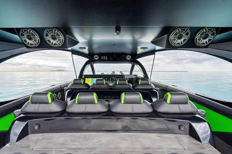 Slide: The Image of Interior of 2026 Mystic Powerboats M5200 XL Cabin with sleek seating and modern design. - 26