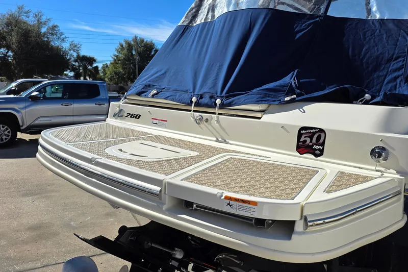 Slide: The Image of 2010 Sea Ray 260 Sundeck boat with covered deck and MerCruiser 5.0 MPI engine. - 3