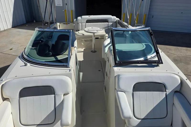 Slide: The Image of 2010 Sea Ray 260 Sundeck boat interior with seating and windshield. - 40