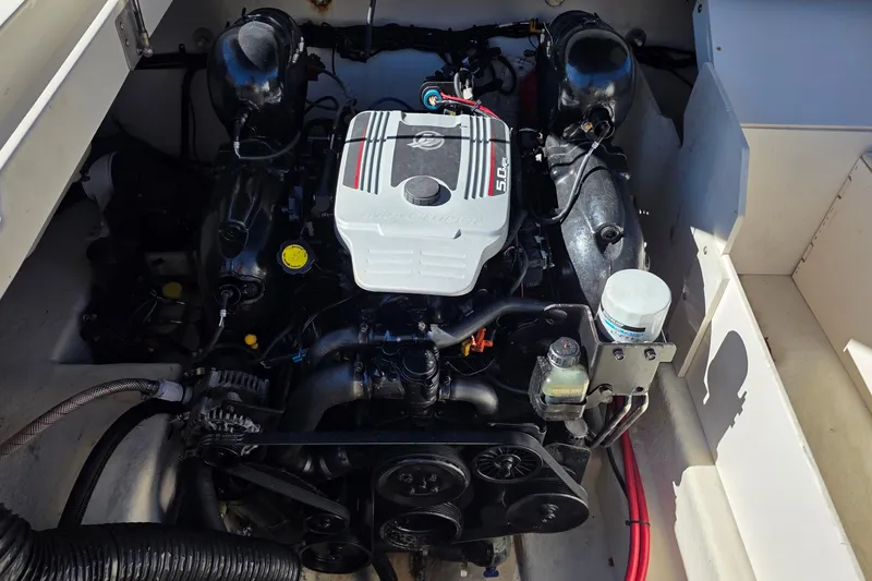 Slide: The Image of Engine compartment of a 2010 Sea Ray 260 Sundeck boat, showcasing the motor components. - 43