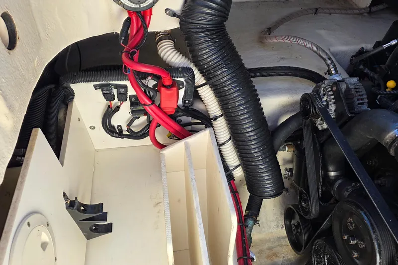 Slide: The Image of Engine compartment of a 2010 Sea Ray 260 Sundeck with visible wiring and components. - 46
