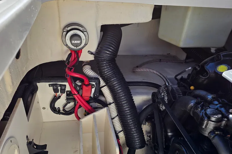 Slide: The Image of Engine compartment of a 2010 Sea Ray 260 Sundeck with visible wiring and components. - 51