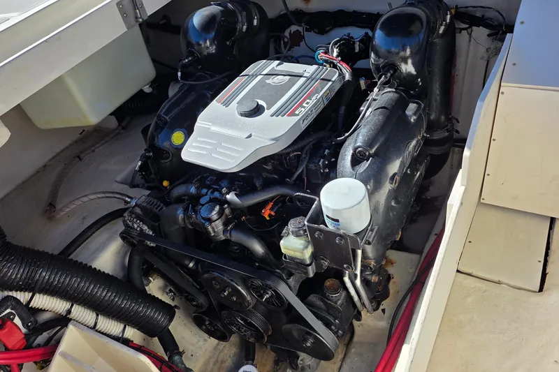 Slide: The Image of Engine compartment of a 2010 Sea Ray 260 Sundeck boat, showcasing the motor and components. - 52
