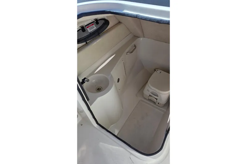 Slide: The Image of Interior of 2010 Sea Ray 260 Sundeck boat with sink and portable toilet. - 7