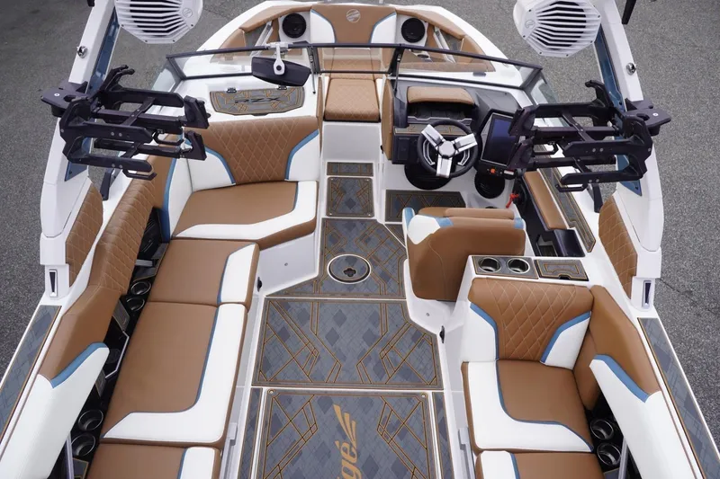 Slide: The Image of Luxurious interior of 2023 Tigé 24RZX boat with brown and white seating, modern design. - 105