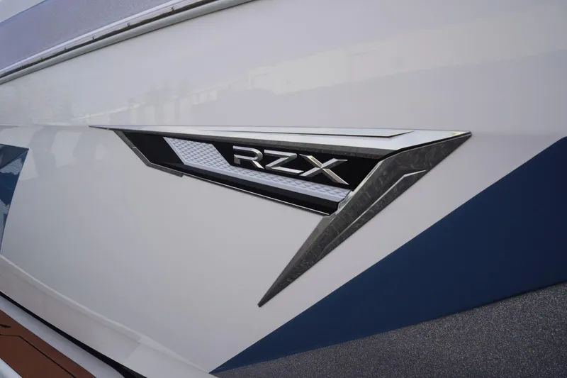 Slide: The Image of 2023 Tigé 24RZX boat emblem with sleek design and modern detailing. - 13