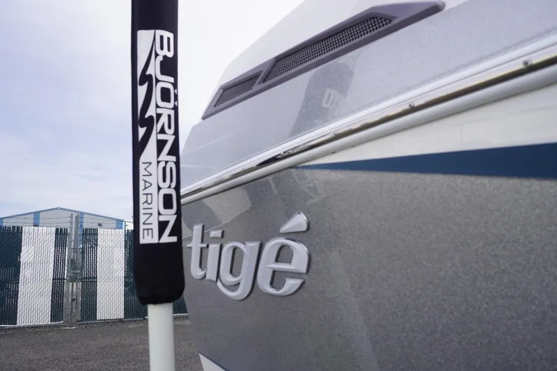 Slide: The Image of 2023 Tigé 24RZX boat at Bjornson Marine dealership, showcasing sleek design. - 16