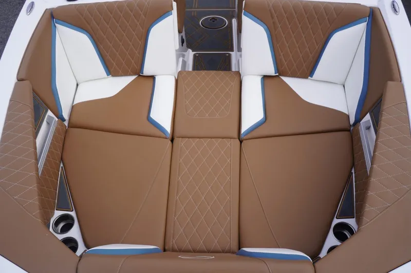 Slide: The Image of 2023 Tigé 24RZX boat interior with brown and white diamond-stitched seating. - 21