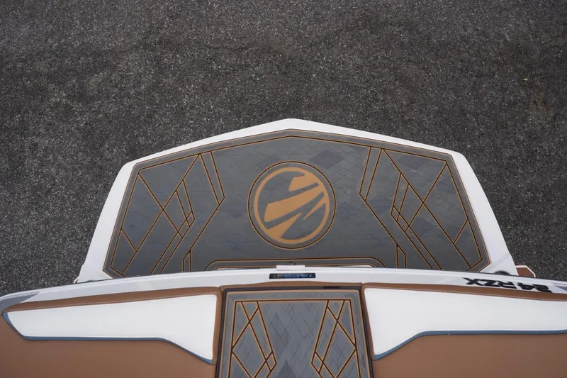 Slide: The Image of 2023 Tigé 24RZX boat deck with geometric design and logo, viewed from above. - 26