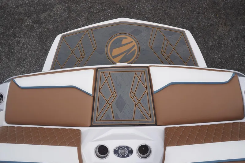 Slide: The Image of 2023 Tigé 24RZX boat interior with stylish brown and blue upholstery design. - 27