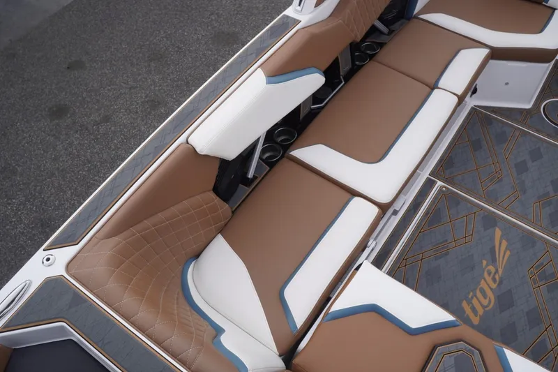 Slide: The Image of 2023 Tigé 24RZX boat interior with luxurious brown and white seating and stylish flooring. - 33