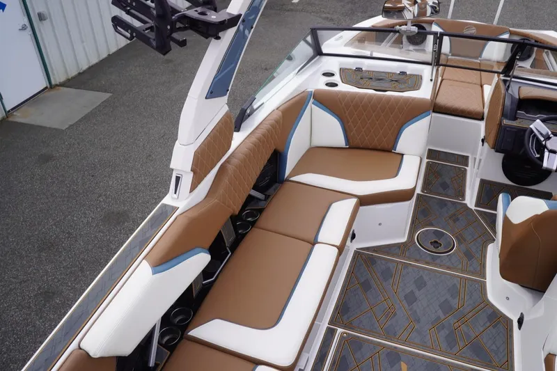 Slide: The Image of 2023 Tigé 24RZX boat interior with luxurious seating and stylish flooring. - 34